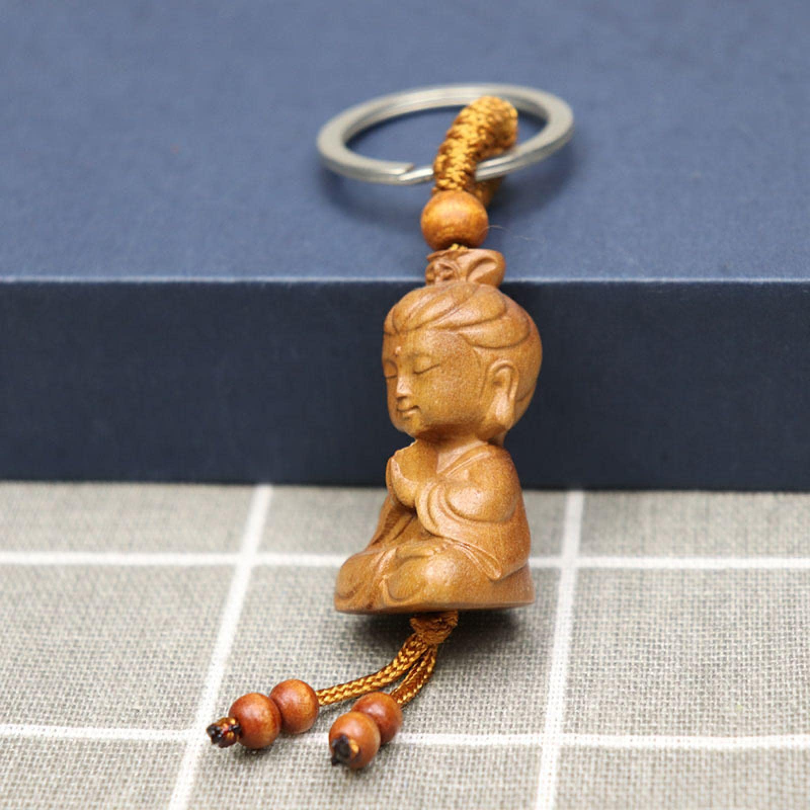 Amazon｜桃木彫り釈迦仏キーホルダー木製観音菩薩キーホルダー付工芸品